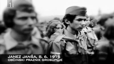 Sedemnajstletni Janez Janša kot brigadir na proslavi občinskega praznika v Grosuplju leta 1975. Tistega leta je Janez tudi zaprosil za vstop v Zvezo komunistov Slovenije (partijo) in bil seveda sprejet. 